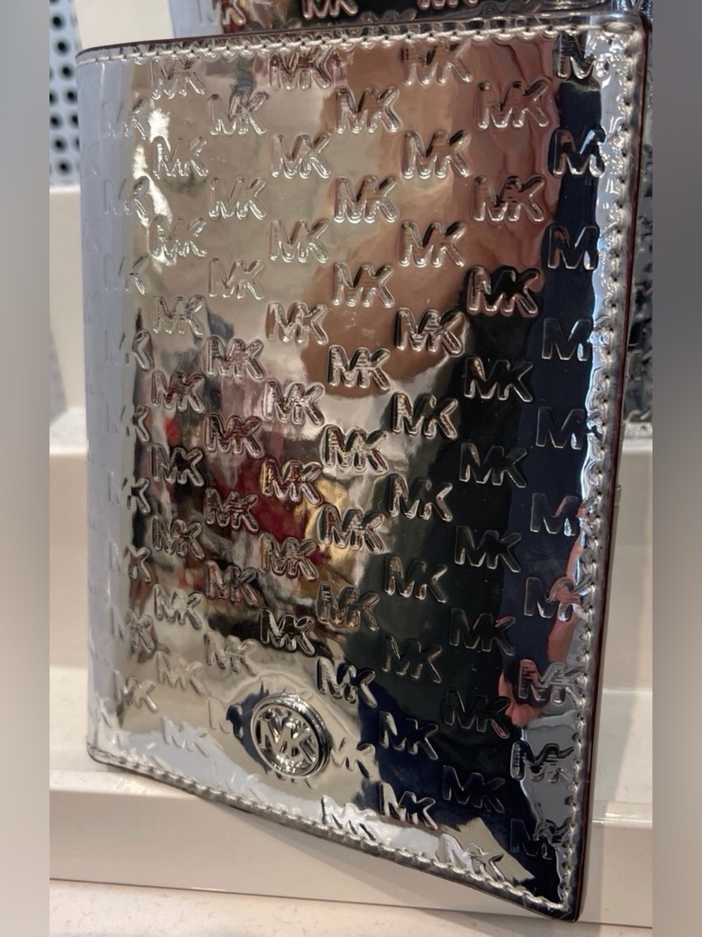 Michael Kors Metallic Silver Embossed MK Passport Cover